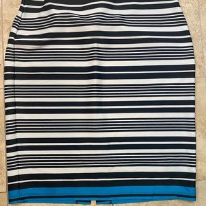 Black and white striped skirt with a turquoise stripe at the bottom